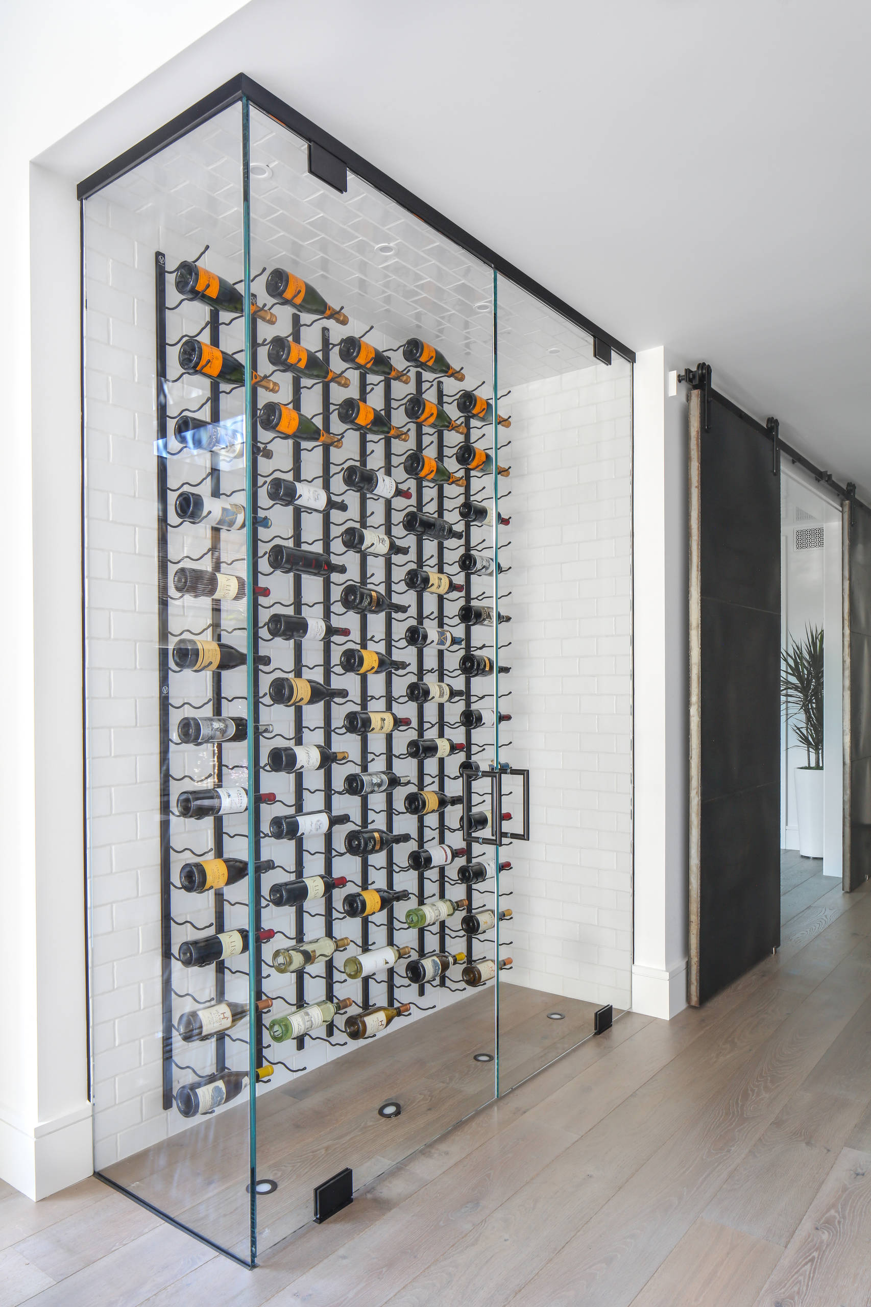 Contemporary wine wall with floating racking in Midland