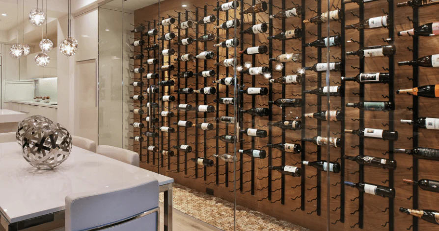 Bronze-accented modern wine wall in a Midland home