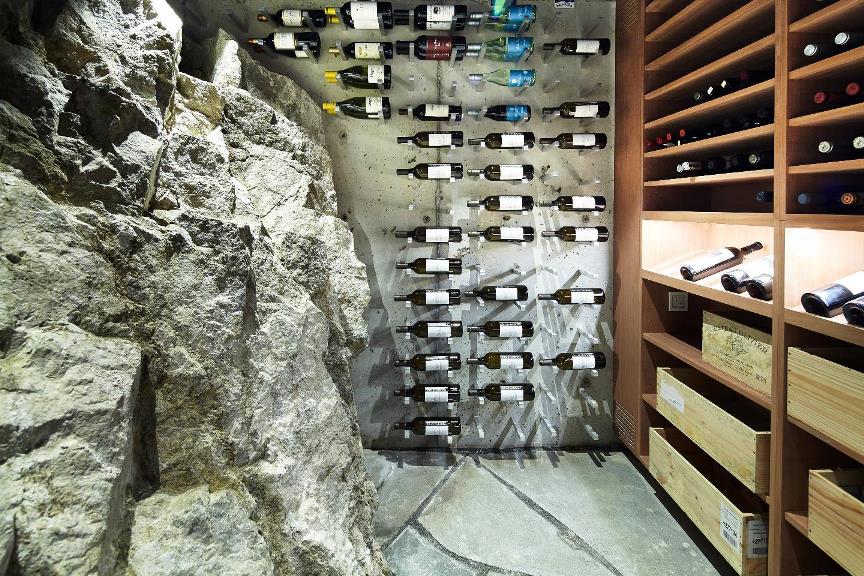 Upgraded wine room with glass panels and LED lighting in Midland
